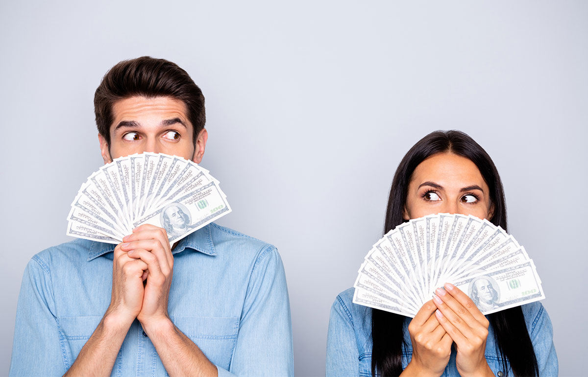 Newly married couple reviewing finances together at home