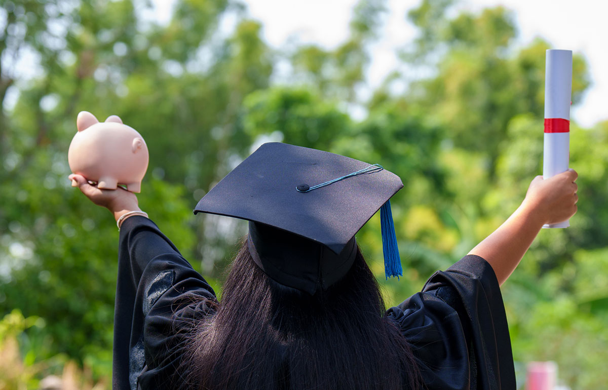 Graduate holding a diploma