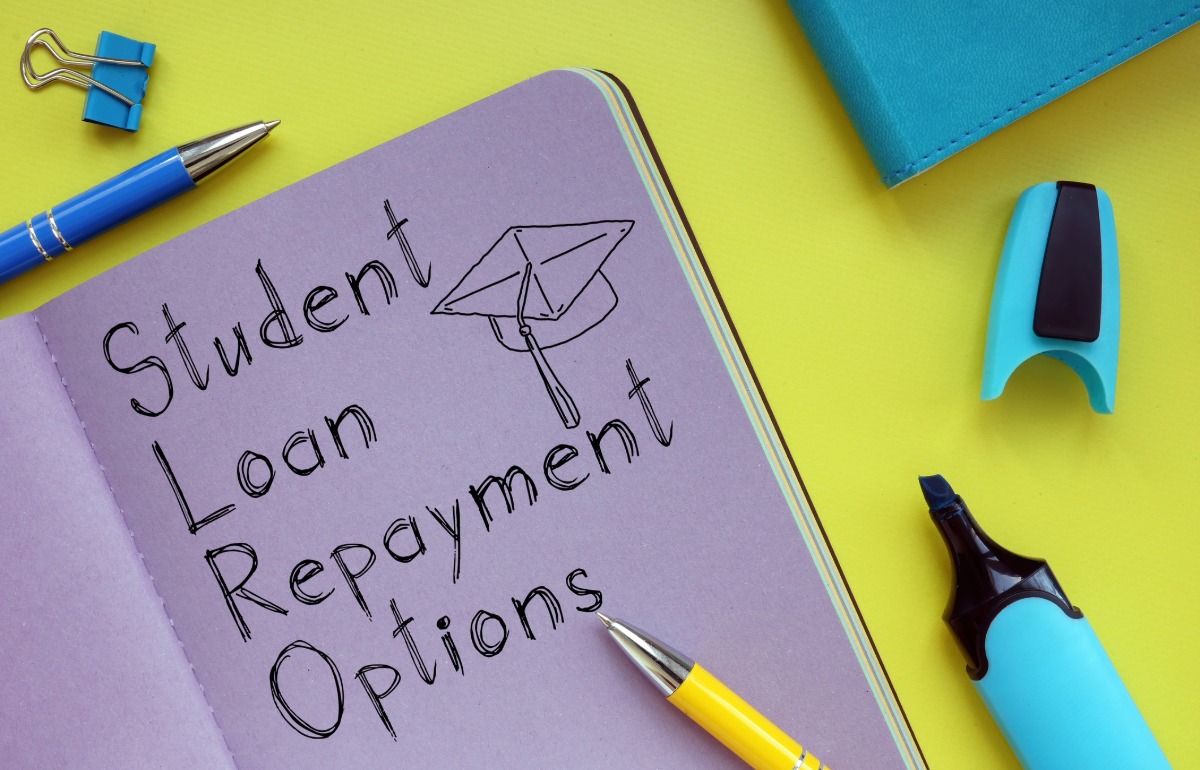 Graduate reviewing student loan repayment and borrowing options.