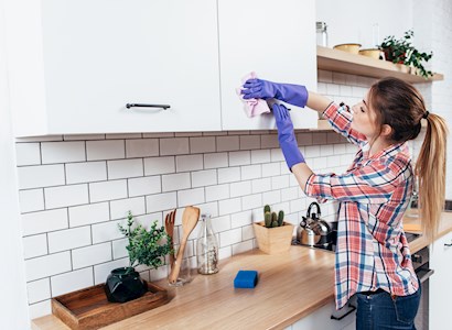 Woman cleaning kitchen