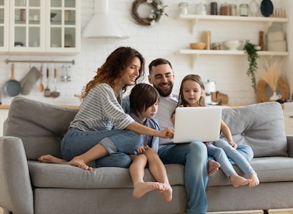Family sitting on the couch.