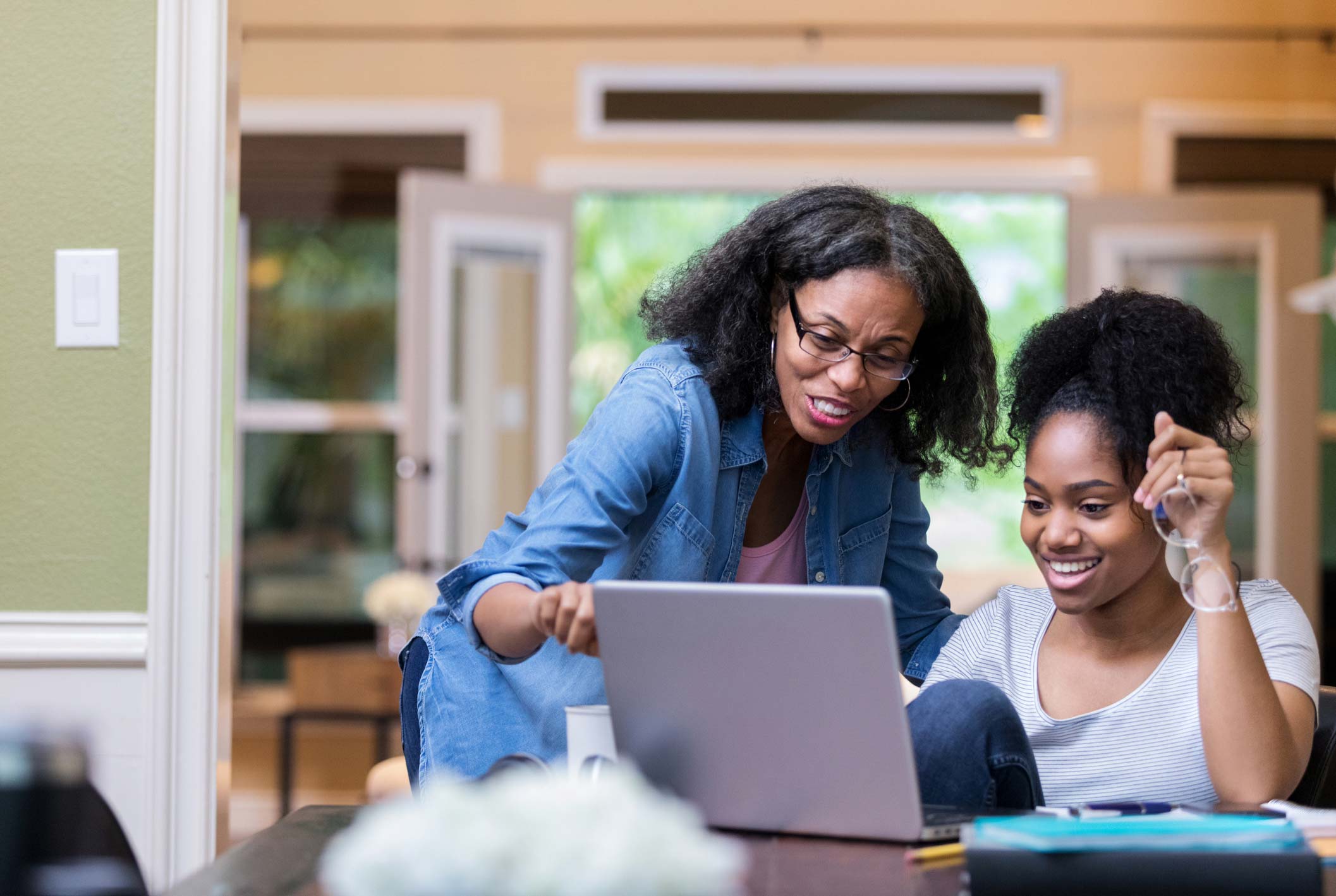 Two women looking at laptop