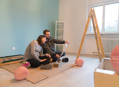 A couple preparing a room for a baby