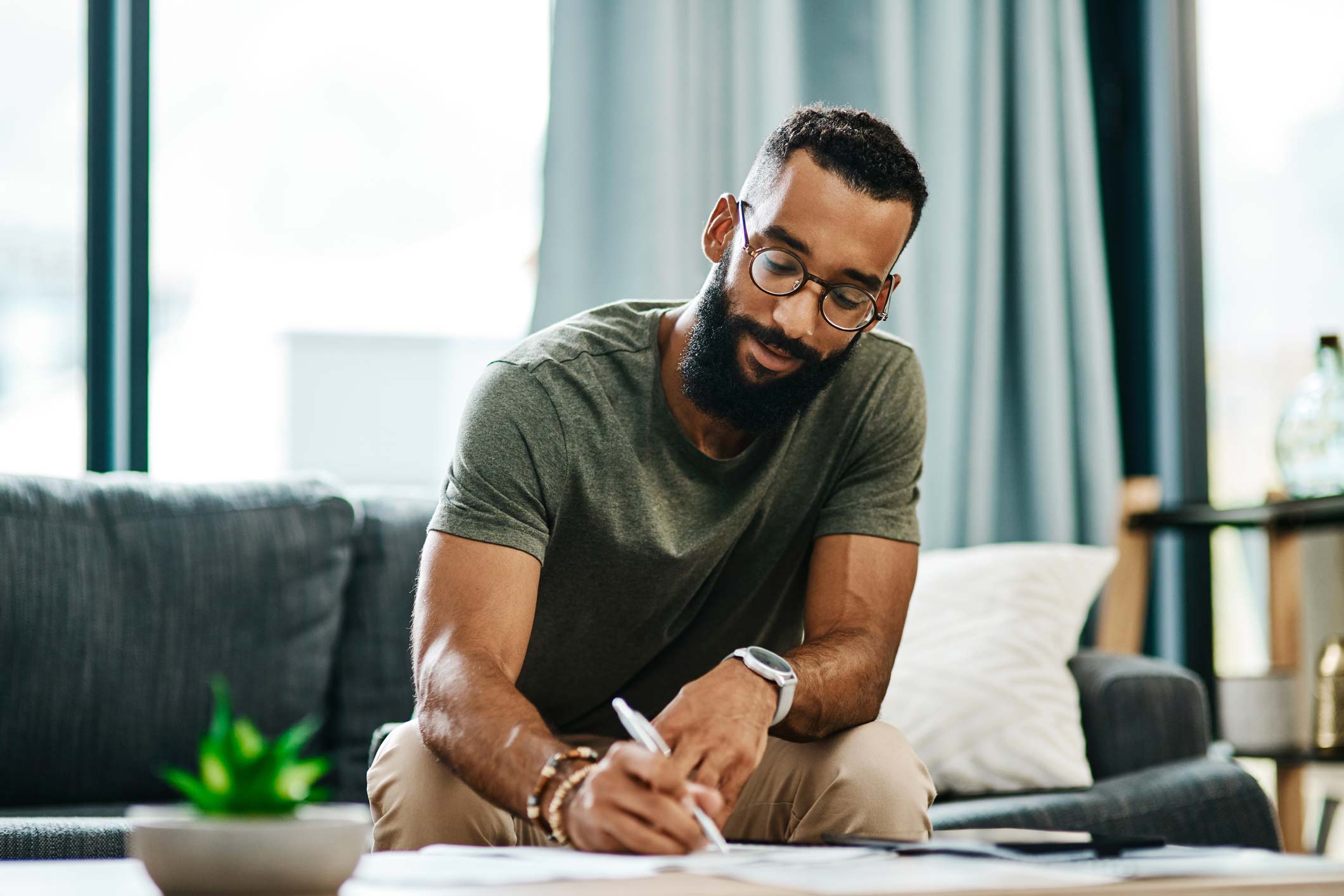 Man working on sofa