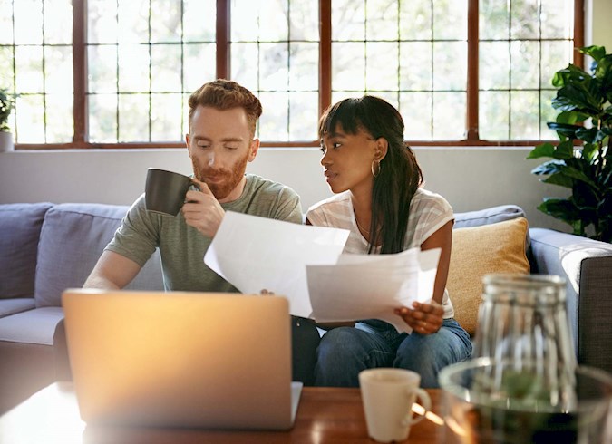 Young couple financial planning together at home