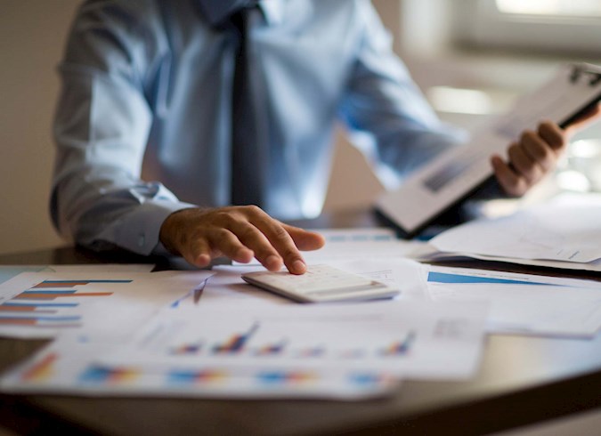 Financial planner working at his desk.