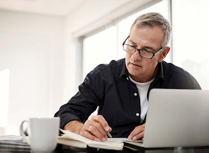 man with glasses working