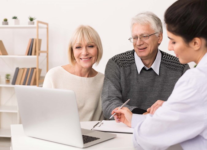 Senior couple working with financial planner