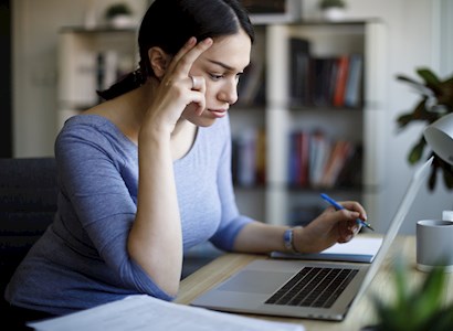 Woman looking at a computer.