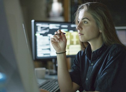 Woman looking at a computer.